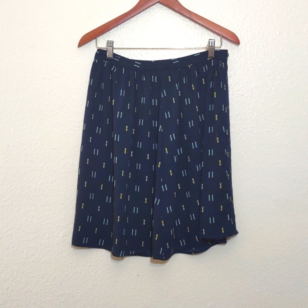 SLIGHTLY USED LOFT BLUE SKIRT WITH YELLOW AND LIGHT BLUE PATTERN SIZE 4